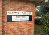 Thumbnail 15 of 17 - a sign on the side of a brick building