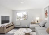 Thumbnail 2 of 13 - a living room with a couch and a television