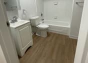 Thumbnail 6 of 13 - a bathroom with a toilet sink and bathtub