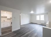Thumbnail 11 of 13 - an empty living room and kitchen in a new home