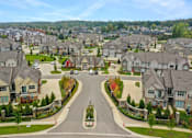 Thumbnail 3 of 20 - an aerial view of a neighborhood with houses and a street at Encore at Manchester, Novi