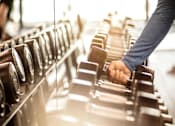 Thumbnail 16 of 20 - a person pressing a button on a conveyor belt in a factory at Encore at Manchester, Novi