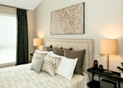 Thumbnail 14 of 20 - a bedroom with a bed at Encore at Manchester, Novi, Michigan