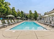 Thumbnail 11 of 35 - Swimming Pool And Relaxing Area at Encore Townhomes, Utica, MI