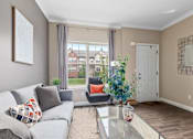 Thumbnail 21 of 35 - Sophisticated Living Room at Encore Townhomes, Utica, 48315