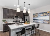 Thumbnail 10 of 38 - Fully Equipped Kitchen With Modern Appliances at Encore at West Valley, White Lake, MI, 48386