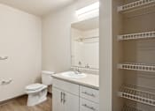 Thumbnail 27 of 32 - a bathroom with a sink toilet and a mirror