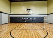 Thumbnail 7 of 32 - the gym at the four corners apartments with a basketball court