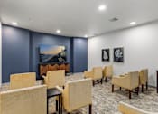 Thumbnail 19 of 46 - A room with blue walls and a painting of a lighthouse on the wall.