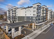 Thumbnail 1 of 46 - A modern apartment building named Ovation Meeker is shown.