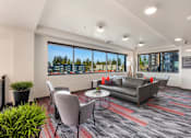 Thumbnail 7 of 25 - A modern office space with a view of the city.