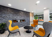 Thumbnail 5 of 25 - A grey and yellow chair is in front of a brick wall.