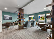 Thumbnail 25 of 66 - A room with a carpeted floor and a white ceiling with a skylight.