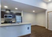 Thumbnail 17 of 31 - Dining Room and Kitchen