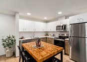 Thumbnail 34 of 43 - Kitchen and Dining Room at Solera Apartments, Renton, WA