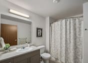 Thumbnail 7 of 21 - A Model bathroom at Kendrick Landing, Affordable Housing in Lakewood, WA with a spacious shower and Vanity