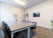Thumbnail 6 of 25 - Conference Room with TV, desk and chairs