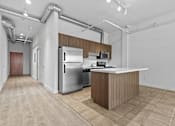 Thumbnail 3 of 46 - a kitchen with stainless steel appliances and a white counter top