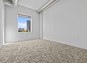 Thumbnail 12 of 46 - an empty room with carpet and a window