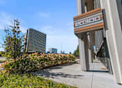 Thumbnail 31 of 46 - a view of a building with plants on the side of it