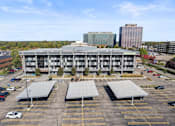 Thumbnail 42 of 46 - an aerial view of a parking lot in front of a building