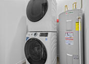 Thumbnail 9 of 46 - a washing machine and a refrigerator in a room
