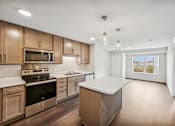 Thumbnail 32 of 43 - the preserve at ballantyne commons apartment kitchen with wooden cabinets