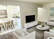 Thumbnail 9 of 39 - a living room with a couch and a table