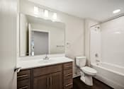 Thumbnail 35 of 43 - the preserve at ballantyne commons apartment bathroom with sink toilet and shower