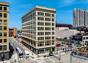Thumbnail 50 of 52 - A city street with a large building in the middle.