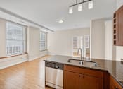 Thumbnail 23 of 68 - the preserve at ballantyne commons apartment kitchen and living room