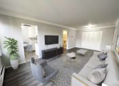 Thumbnail 2 of 39 - a living room with a couch and a tv