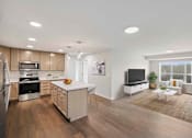 Thumbnail 11 of 43 - an open kitchen and living room with a table