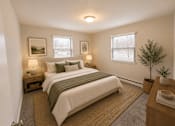 Thumbnail 23 of 23 - A bedroom with a large bed and a small tree.