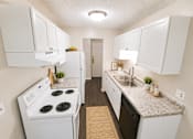 Thumbnail 4 of 20 - A kitchen with white cabinets and a black dishwasher.
