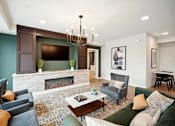 Thumbnail 4 of 43 - a living room with a fireplace and a tv