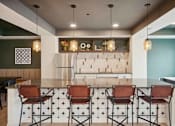 Thumbnail 15 of 43 - a large kitchen and dining area with chairs and a table