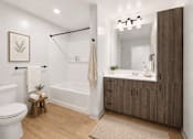 Thumbnail 7 of 54 - A bathroom with a white toilet, a white bathtub, a wooden cabinet, and a mirror.