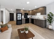 Thumbnail 2 of 54 - A modern kitchen with dark wood cabinets and a black refrigerator.