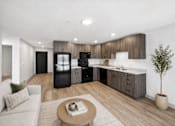 Thumbnail 6 of 54 - A modern kitchen with a black fridge and stove, a wooden countertop, and a small tree in a pot.