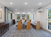 Thumbnail 18 of 42 - A room with a carpeted floor and wooden furniture.