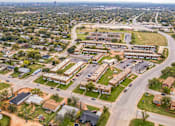 Thumbnail 13 of 13 - A bird's eye view of a residential area with apartment buildings and houses.