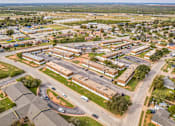 Thumbnail 12 of 13 - A bird's eye view of a residential area with houses and roads.
