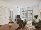 Thumbnail 7 of 13 - a living room with a table and chairs and a tv