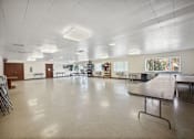 Thumbnail 8 of 12 - a large room with a table in the middle of it