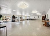 Thumbnail 9 of 12 - a large room with a white ceiling and tables and chairs