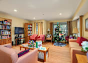 Thumbnail 10 of 24 - a living room filled with furniture and a christmas tree