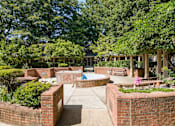 Thumbnail 20 of 24 - a courtyard with a pool and benches and trees