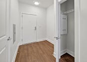 Thumbnail 14 of 20 - A white door is open to a small white closet.