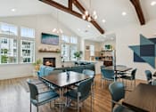 Thumbnail 8 of 19 - A modern dining room with a large table and chairs.